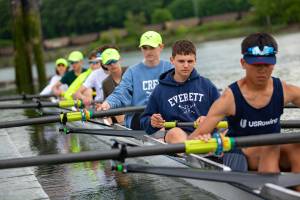 Members of Everett Rowing Association’s boys U16 8+ group push off from the dock before practice Thursday, June 2, 2022, at Langus Riverfront Park in Everett, Washington. (Ryan Berry / The Herald)