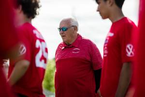 Mike Price watches players run through drills on Wednesday, June 8, 2022 in Everett, Washington. (Olivia Vanni / The Herald)