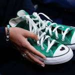 Camila Alves McConaughey holds a pair of green Converse tennis shoes similar to those worn by Uvalde shooting victim Maite Yuleana Rodriguez, 10, as her husband Matthew McConaughey, a native of Uvalde, Texas, joins White House press secretary Karine Jean-Pierre for the daily briefing at the White House in Washington, D.C., June 7. Because of the injuries to Maites body, McConaughey said, her identity was confirmed by her green shoes. (Susan Walsh / Associated Press)