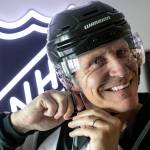 Vaughan Rody dons his linesman gear on June 6 at his home in Lake Stevens. Rody officiated in the National Hockey League for 22 years and worked his last game in April before retiring. (Ryan Berry / The Herald)