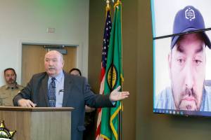 Detective Jim Scharf, left, of Snohomish County Sheriff’s Office with David Mittelman, CEO of Othram Inc. announces the identification on two cold cases Thursday afternoon in the Snohomish County Courthouse in Everett, Washington on June 16, 2022. (Kevin Clark / The Herald)