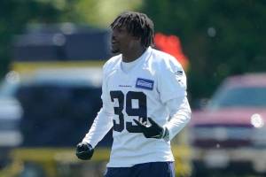 Seattle Seahawks cornerbacks Elijah Jones (37), Coby Bryant (8) and Tariq Woolen (39) talk during NFL football practice, Tuesday, May 31, 2022, in Renton, Wash. (AP Photo/Ted S. Warren)