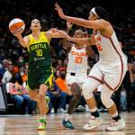 The Storms Sue Bird drives to the hoop for a layup during a game against the Sun on June 5, 2022, in Seattle. (Olivia Vanni / The Herald)