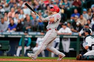 Los Angeles Angels' Mike Trout watches his two-run home run during the third inning of the team's baseball game against the Seattle Mariners, Thursday, June 16, 2022, in Seattle. (AP Photo/Ted S. Warren)