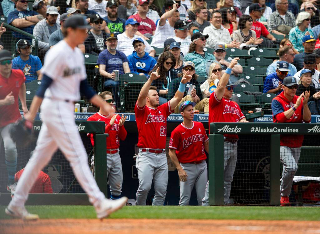 The Angels dugout reacts to a scoring hit during the game against the Angels on Sunday, June 19, 2022 in Seattle, Washington. (Olivia Vanni / The Herald)