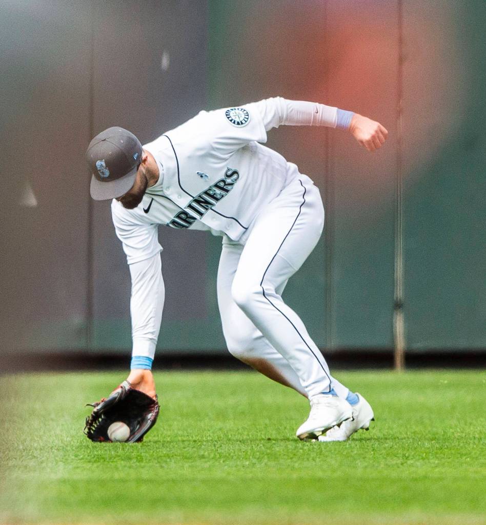 Mariners Jesse Winker fields the ball in the outfield during the game against the Angels on Sunday, June 19, 2022 in Seattle, Washington. (Olivia Vanni / The Herald)