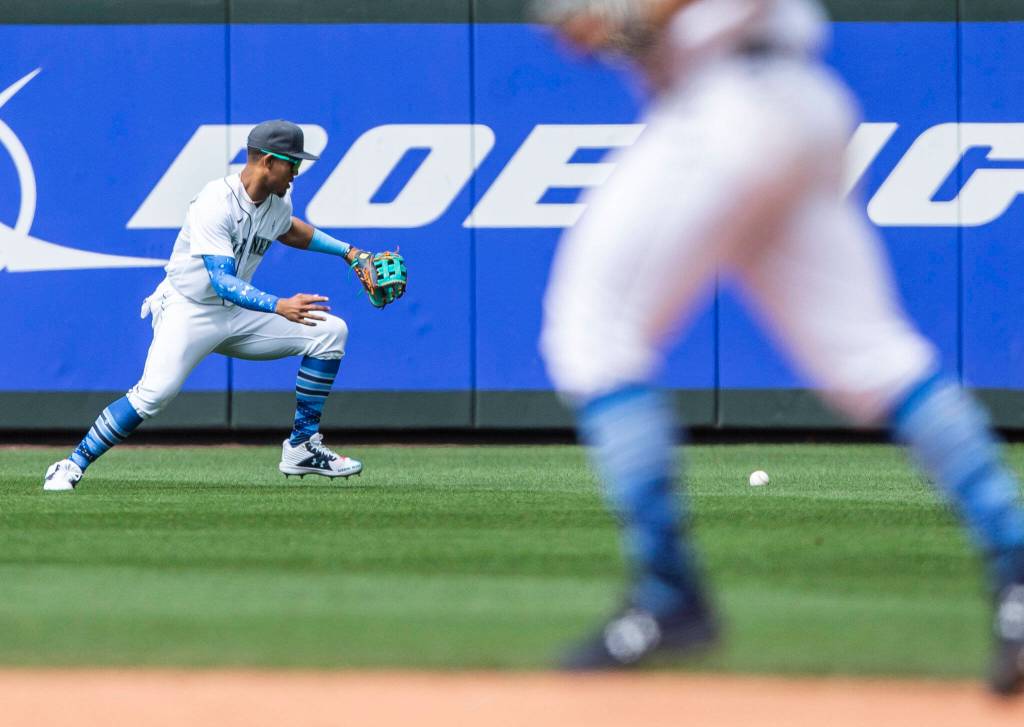 Mariners Julio Rodriguez misses a ground ball to the outfield during the game against the Angels on Sunday, June 19, 2022 in Seattle, Washington. (Olivia Vanni / The Herald)