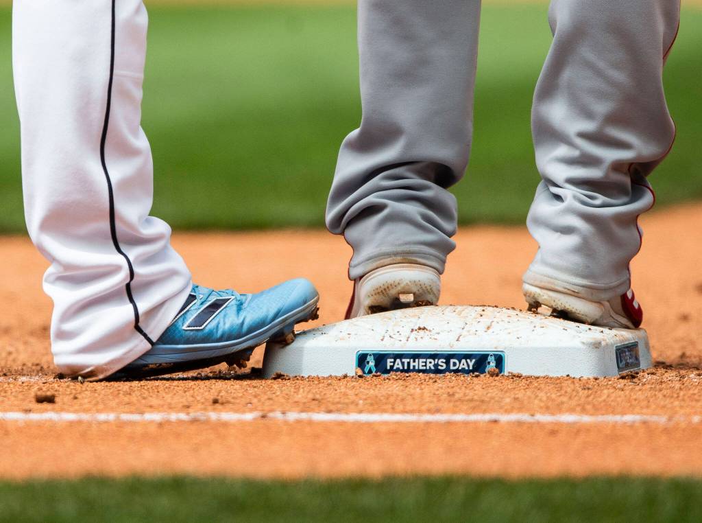 Fathers Day decals are visible on the first base at T-Mobile Park during the game against the Angels on Sunday, June 19, 2022 in Seattle, Washington. (Olivia Vanni / The Herald)