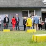 Officials tour the site of the proposed Faith Family Village on Wednesday at Faith Lutheran Church in Everett. (Kevin Clark / The Herald)