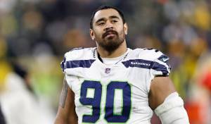 Seattle Seahawks defensive tackle Bryan Mone walks off the field after a game against the Green Bay Packers on Nov. 14, 2021, in Green Bay, Wis. (AP Photo/Kamil Krzaczynski)