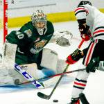 Everett's Braden Holt stops a shot by Portland's Robbie Fromm-Delorme in the second period Friday night at the Angel of the Winds Arena in Everett on October 8, 2021. (Kevin Clark / The Herald)