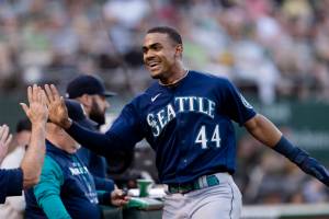 Seattle Mariners' Julio Rodriguez reacts after scoring a run against the Oakland Athletics during the sixth inning of a baseball game in Oakland, Calif., Tuesday, June 21, 2022. (AP Photo/John Hefti)