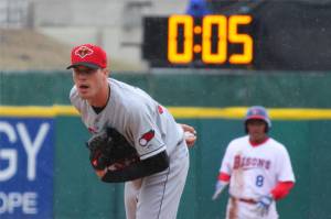 Rochester Red Wings pitcher Alex Meyer (32) looks in for a signal as a 20-second pitch clock is used for the Triple-A baseball opener between the Buffalo Bisons and Rochester Red Wings in Buffalo, N.Y., Thursday, April 9, 2015. (AP Photo/Bill Wippert)
