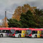 Buses charge October 22, 2021 at the Everett Transit base in Everett. The city plans to continue replacing its diesel and diesel hybrid buses with battery electric buses in its six-year transportation improvement program. (Kevin Clark / Herald file)