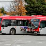Buses charge before their next route Friday afternoon at the Everett Transit Center in Everett on October 22, 2021.  (Kevin Clark / The Herald)