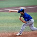 The Everett Merchants’ Jacob Sesso, from Everett, deals during a game against the Seattle Blackfins on Wednesday, June 22, 2022, at Funko Field in Everett, Washington. (Ryan Berry / The Herald)