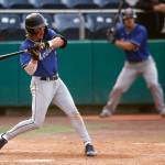 The Everett Merchants’ Cole Cramer, from Arlington, grounds the ball to the left side during a game against the Seattle Blackfins on Wednesday, June 22, 2022, at Funko Field in Everett, Washington. (Ryan Berry / The Herald)