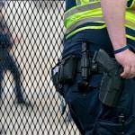 A Capitol Police officer rests his hand near his gun as he works by the anti-scaling fencing outside the Supreme Court, Thursday, June 23, 2022, in Washington. (Jacquelyn Martin / Associated Press)