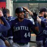Seattle Mariners Julio Rodriguez is congratulated by teammates in the dugout after hitting a solo home run during the fourth inning of a game against the Los Angeles Angels on Friday in Anaheim, Calif. (AP Photo/Mark J. Terrill)