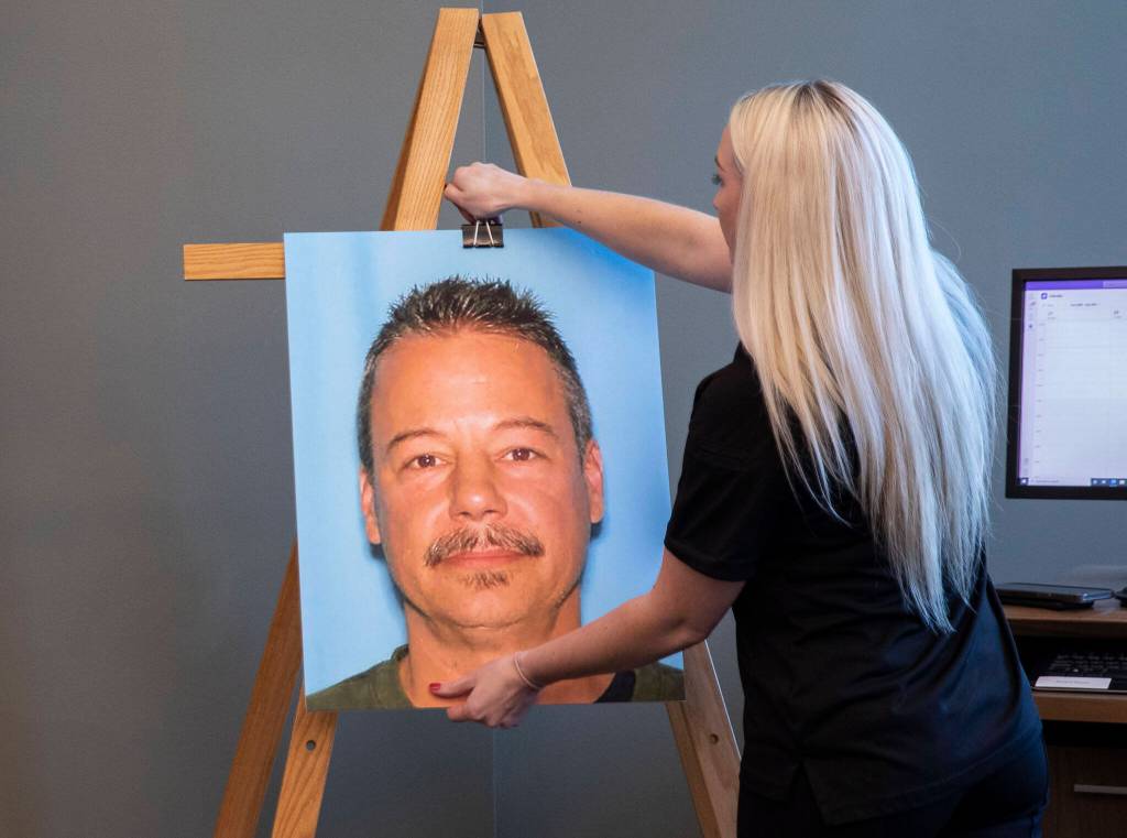 A photo of Robert Anthony Brooks is placed on display during the Snohomish County Sheriffs Office press conference announcing him as a suspect in Michelle Koskis 1990 cold case on Thursday in Everett. (Olivia Vanni / The Herald)