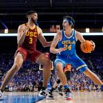 UCLA guard Jaime Jaquez Jr. (right) tries to get by Southern California forward Isaiah Mobley during the second half of a game on March 5, 2022, in Los Angeles. (AP Photo/Mark J. Terrill)