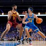 FILE - UCLA guard Jaime Jaquez Jr., right, tries to get by Southern California forward Isaiah Mobley during the second half of an NCAA college basketball game on March 5, 2022, in Los Angeles. UCLA and Southern California are planning to leave the Pac-12 for the Big Ten Conference in a seismic change that could lead to another major realignment of college sports. A person who spoke to The Associated Press on Thursday, June 30, 2022, on condition of anonymity because the schools' talks with the Big Ten have not been made public said the schools have taken steps to request an invitation to join the conference. (AP Photo/Mark J. Terrill, File)