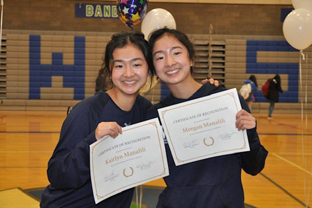 Sisters Kaitlyn and Morgan Manalili at a signing day ceremony at Shorewood High School. (Kristi Lin)