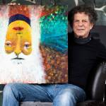 Oskar with his painting that also doubles as the album art work on his album, Never Forget. (Olivia Vanni / The Herald)