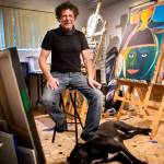 Lee Oskar and his dog Tex inside his art studio in his home on Wednesday, March 2, 2022 in Everett, Washington. (Olivia Vanni / The Herald)