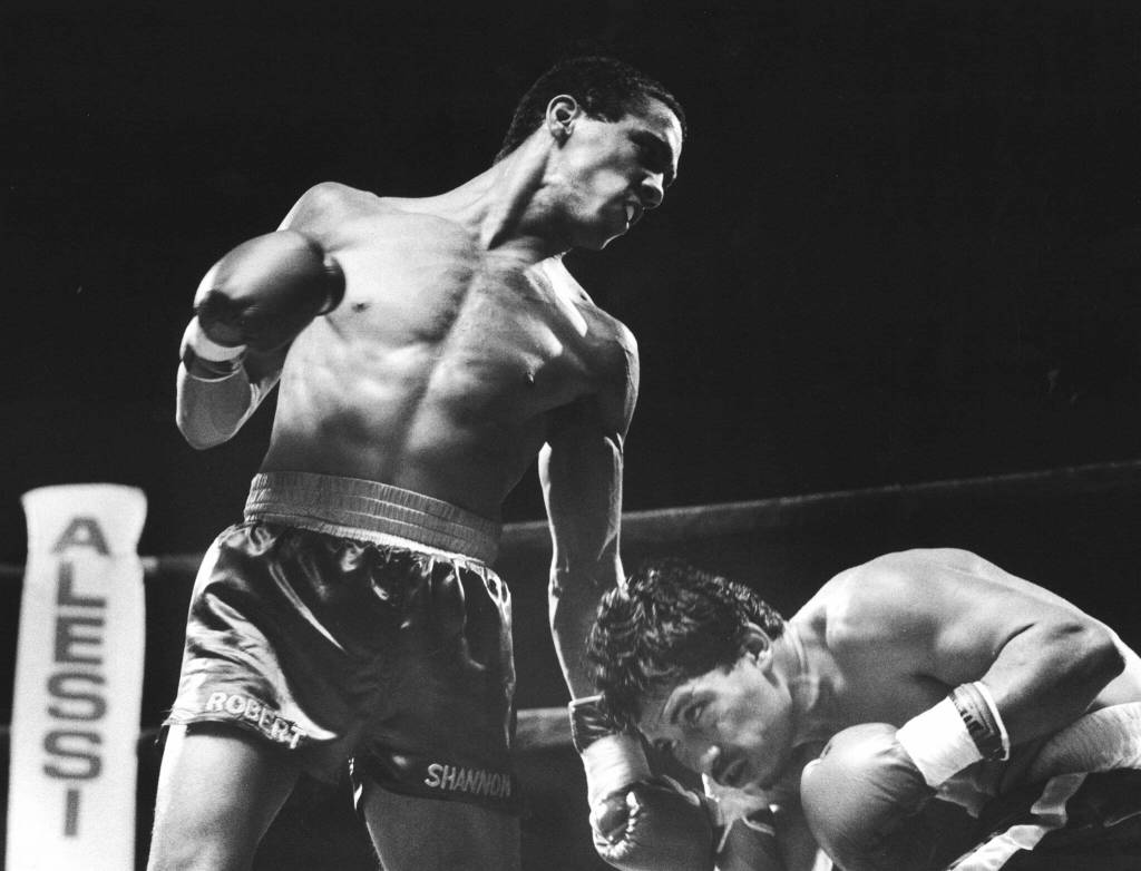 Olympic boxer and Woodway High School graduate Robert Shannon has Saverino Sal Garcia at a disadvantage as Garcia tries to duck away midway through a bout in Edmonds. (Dan Bates / The Herald)