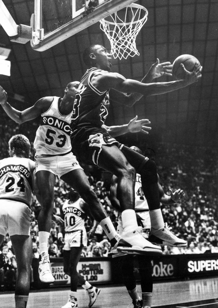 NBA legend Michael Jordan makes a move against the Seattle SuperSonics. (Jim Leo / The Herald)