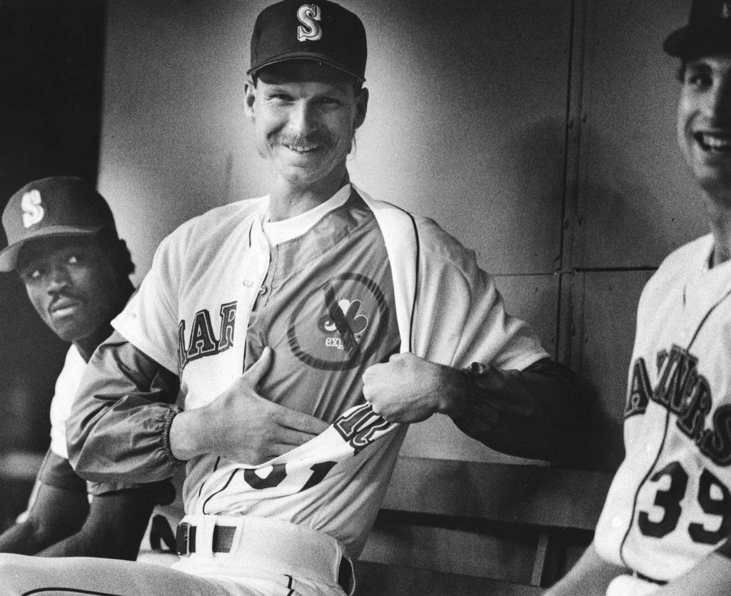 Newly acquired Seattle Mariners pitcher Randy Johnson shows off a Montreal Expos shirt under his Mariners jersey at the Kingdome. (Dan Bates / The Herald)