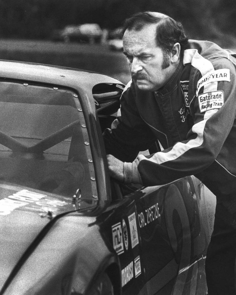 Arlington High School graduate and local racing legend Carl Zaretzke starts his engine before a race at Evergreen Speedway. (Matt Todd / The Herald)