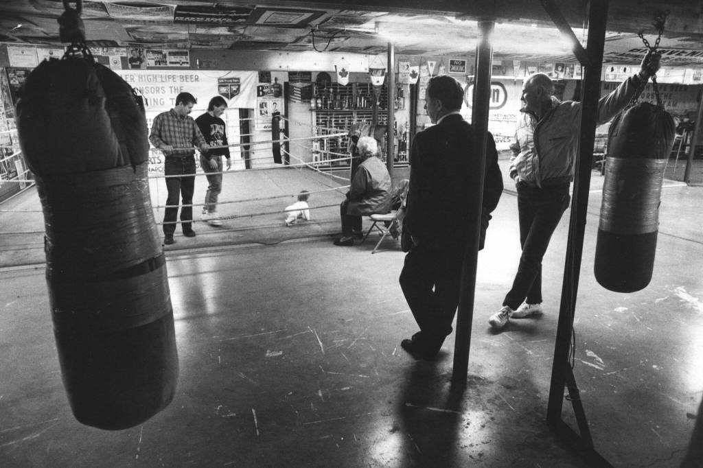 People with a common interest in the Everett Firefighters Boxing Club in Marysville talk of the clubs possible demise. Mike Tisdel, boxing coach, Bret Summers, boxer, Brets daughter, Kelsey, Brets mom, Claudia Summers. (Dan Bates / The Herald)