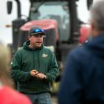 Jon Van Nieuwenhuyzen of Werkhoven Dairy speaks to a group of visitors while discussing the Qualco Energy anaerobic digester the dairy uses on June 17 in Monroe. (Ryan Berry / The Herald)