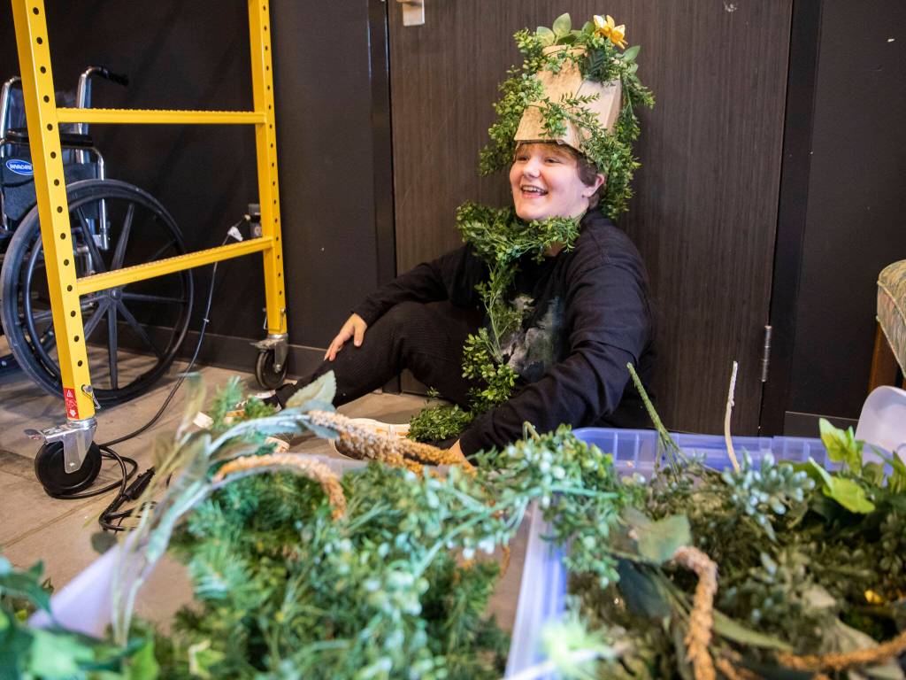 Ayvah Lee smiles while working on foliage themed costumes during a theater summer class on July 7, in Marysville. (Olivia Vanni / The Herald)