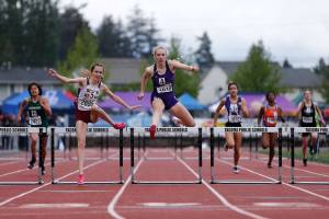 Lake Stevens’ Chloe Pattison falls just behind in the final moments of the 4A girls 300 hurdles Saturday, May 28, 2022, at the 2022 WIAA State Track & Field Championships at Mount Tahoma High School in Tacoma, Washington. (Ryan Berry / The Herald)