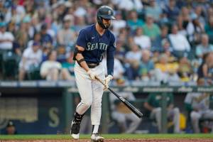 Seattle Mariners' Jesse Winker reacts after grounding out against the Oakland Athletics during the fourth inning of a baseball game Friday, July 1, 2022, in Seattle. (AP Photo/Ted S. Warren)