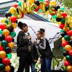 Junelle Lewis (right), daughter Tamara Grigsby and son Jayden Hill sing Lift Every Voice and Sing during Monroes Juneteenth celebration on Saturday, June 18. (Olivia Vanni / The Herald)
