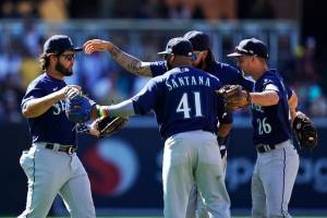 Seattle Mariners infielders react after the Mariners defeated the San Diego Padres 6-2 in a baseball game Tuesday, July 5, 2022, in San Diego. (AP Photo/Gregory Bull)