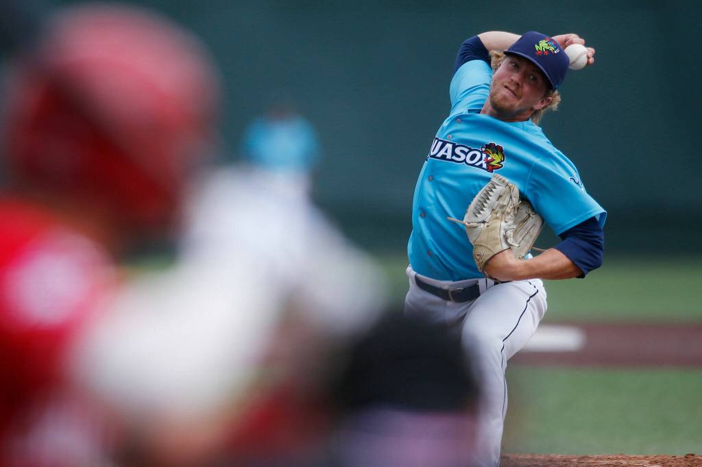 The AquaSoxs Evan Johnson pitches in relief during a game against the Vancouver Canadians Wednesday, July 6, 2022, at Funko Field in Everett, Washington. (Ryan Berry / The Herald)