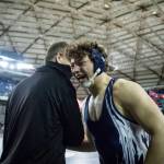 Jacob Erickson embraces Glacier Peak athletic director Kevin Judkins after winning the Class 4A 220-pound championship match at the Mat Classic XXXIII on Feb. 19 in Tacoma. (Olivia Vanni / The Herald)