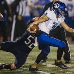 Glacier Peaks Jacob Erickson tackles a Bothell player during a game on Nov. 12, 2021 in Snohomish. (Olivia Vanni / The Herald)