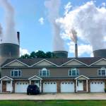 FILE - American Electric Power's John Amos coal-fired plant in Winfield, W.Va, is seen from an apartment complex in the town of Poca across the Kanawha River on Aug. 23, 2018. The Supreme Court decision June 30, 2022, restricting the authority of the Environmental Protection Agency may mean continued pollution from power plants in states that are not switching to cleaner energy. But many states are switching and experts say they'll remain free to keep cleaning up their electrical grids under the new decision. (AP Photo/John Raby, File)