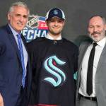Shane Wright poses for photos after being selected by the Seattle Kraken with the fourth pick in the NHL hockey draft in Montreal on Thursday, July 7, 2022. (Ryan Remiorz/The Canadian Press via AP)