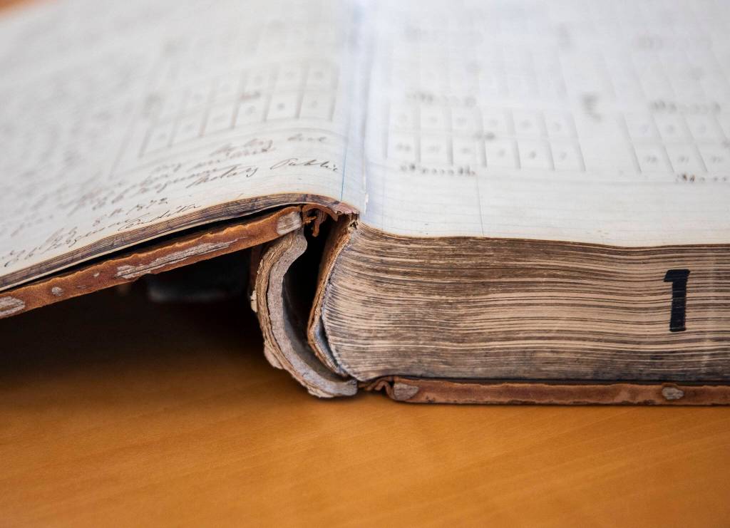 The split binding visible on Book 1 of the Snohomish County Deeds records on Tuesday, in Everett. (Olivia Vanni / The Herald)