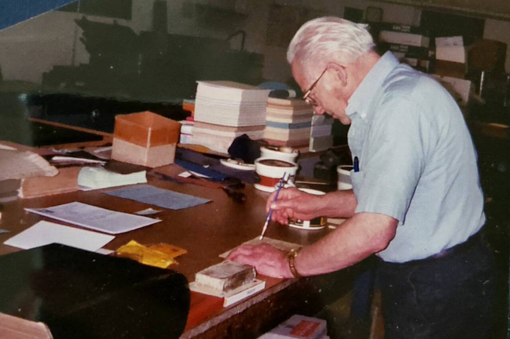 The late book binder Roy Gerrard is pictured here working on a repair project in his shop in Everett. Gerrard helped bind and repair record books for Snohomish County. (Courtesy of Jennifer Gerrard)