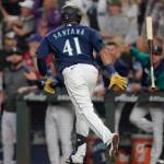 Seattle Mariners' Carlos Santana tosses his bat after he hit a two-run home run during the seventh inning of the team's baseball game against the Toronto Blue Jays, Saturday, July 9, 2022, in Seattle. (AP Photo/Ted S. Warren)