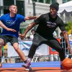 Kiante Woods of MUV Elite (right) dribbles against CPC MLTs Brevin Brown during the Mens Elite Championship game at Everett 3on3 on Sunday in downtown Everett. (Ryan Berry / The Herald)