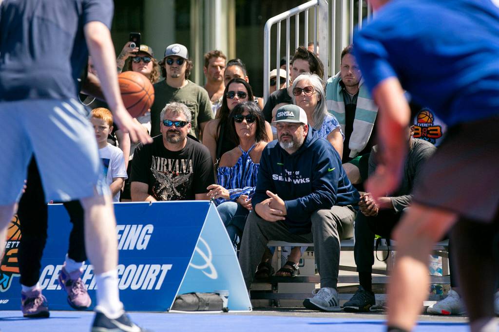 Fans stick around to watch the Mens Elite Championship, which was the final game at Everett 3on3 on Sunday in downtown Everett. (Ryan Berry / The Herald)